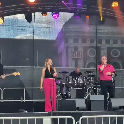 Full band shot on stage